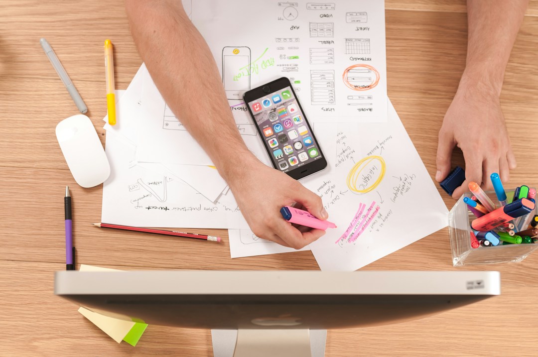 Expecting mother's resources and planning with sketches, phone, and design tools.