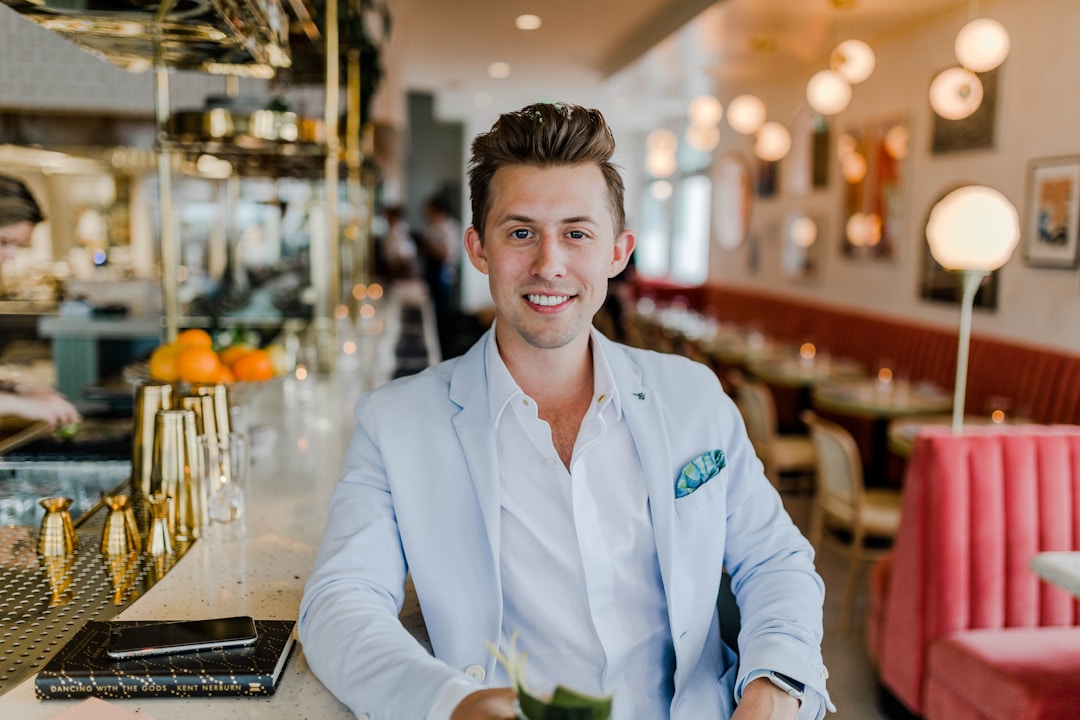 Business leader Chad Storey smiling in a modern restaurant setting, demonstrating adaptability and versatility.
