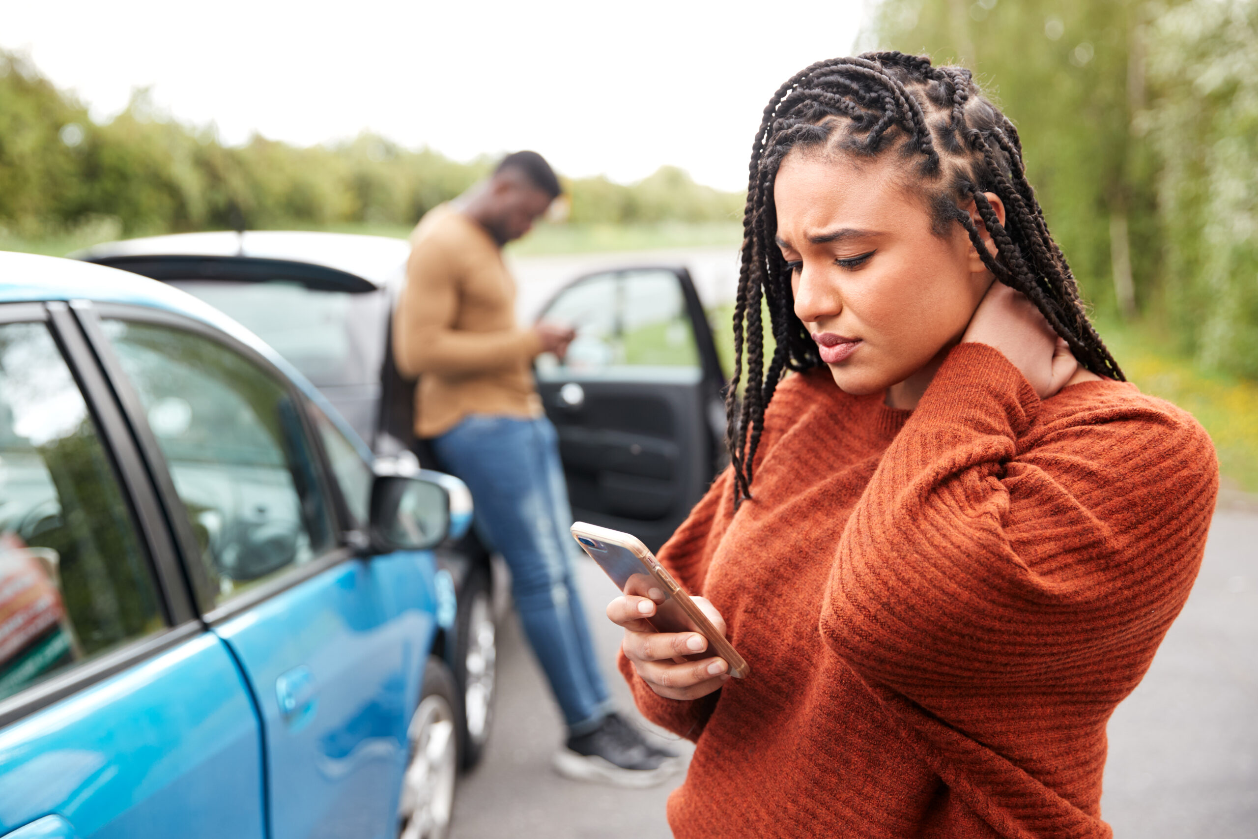 Woman injured in car accident calling insurance company, steps after rideshare accident.
