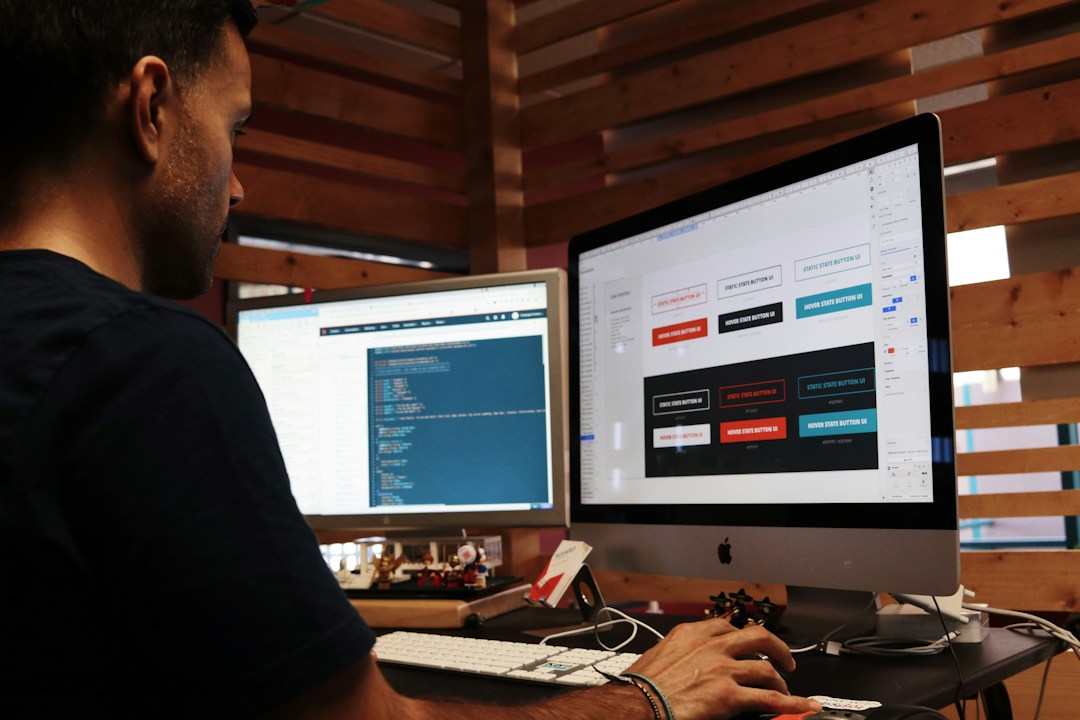 Man working on computer designing website for political campaign.