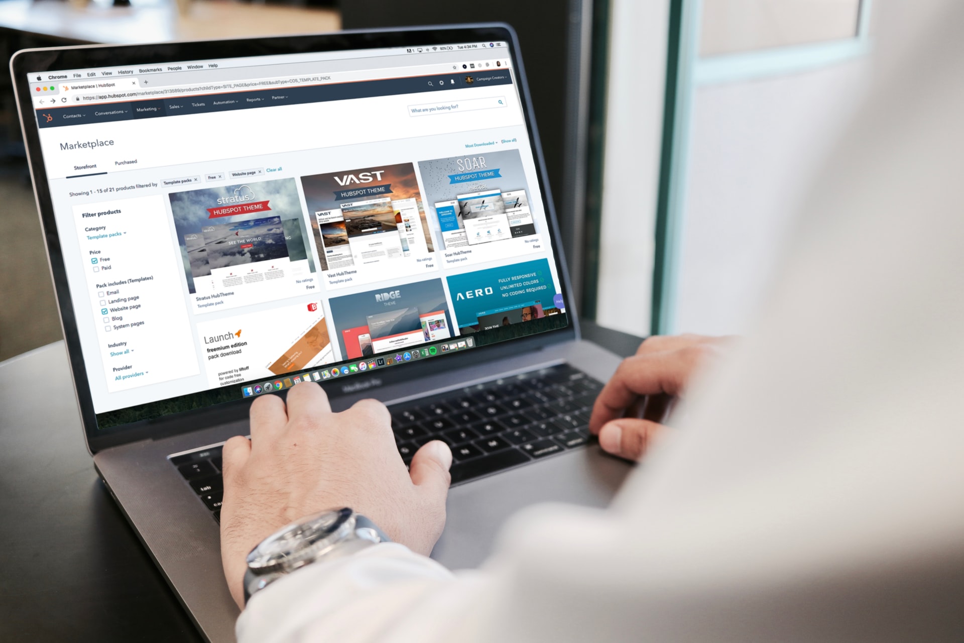 Laptop displaying online marketplace interface illustrating remote team management tools and objectives.