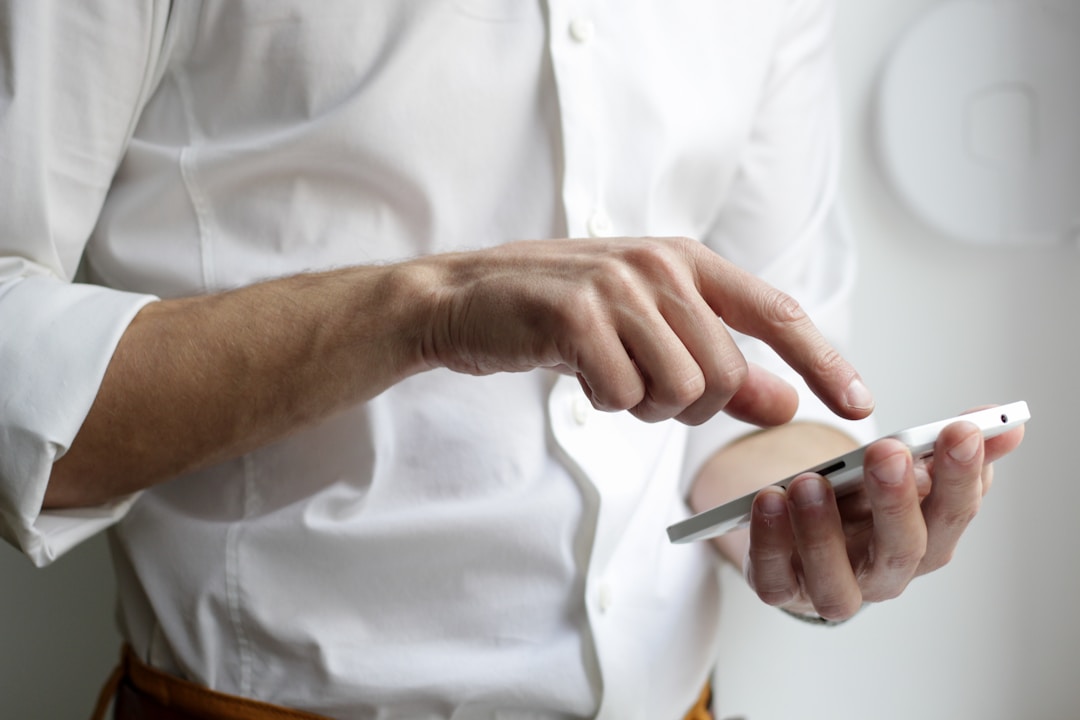 Man interacting with smartphone illustrating online ordering platforms for restaurants