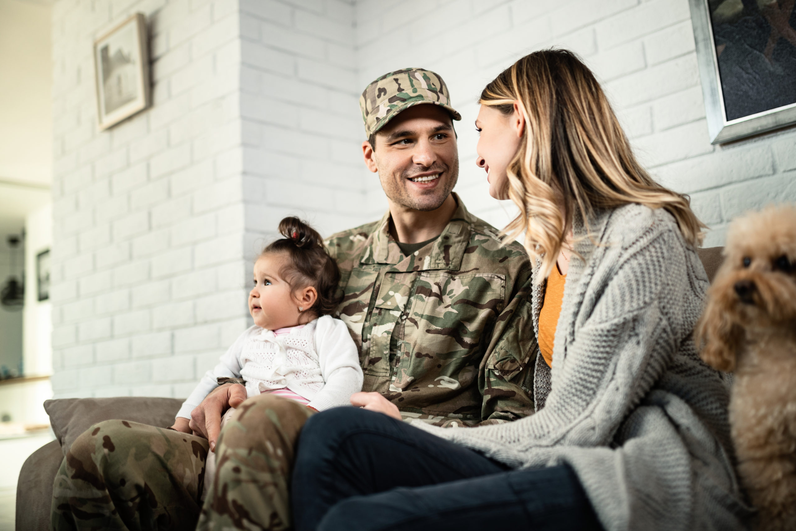 Happy military family reuniting at home, supporting veterans and service members