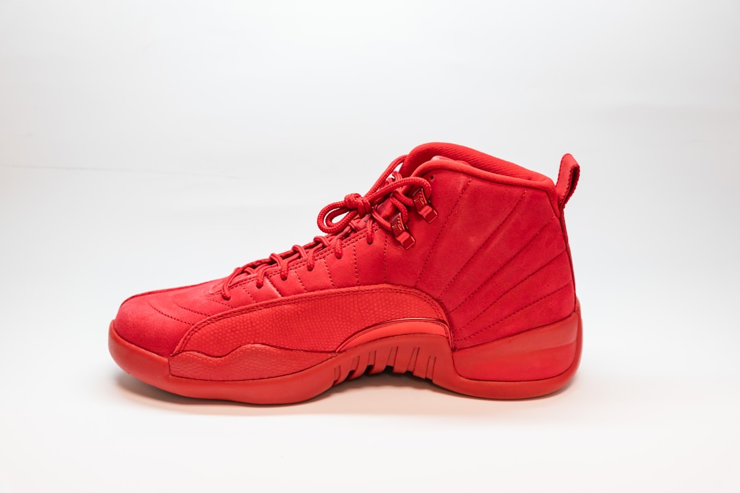 Red athletic shoes illustrating manufacturer outlet deals and fashionable footwear.
