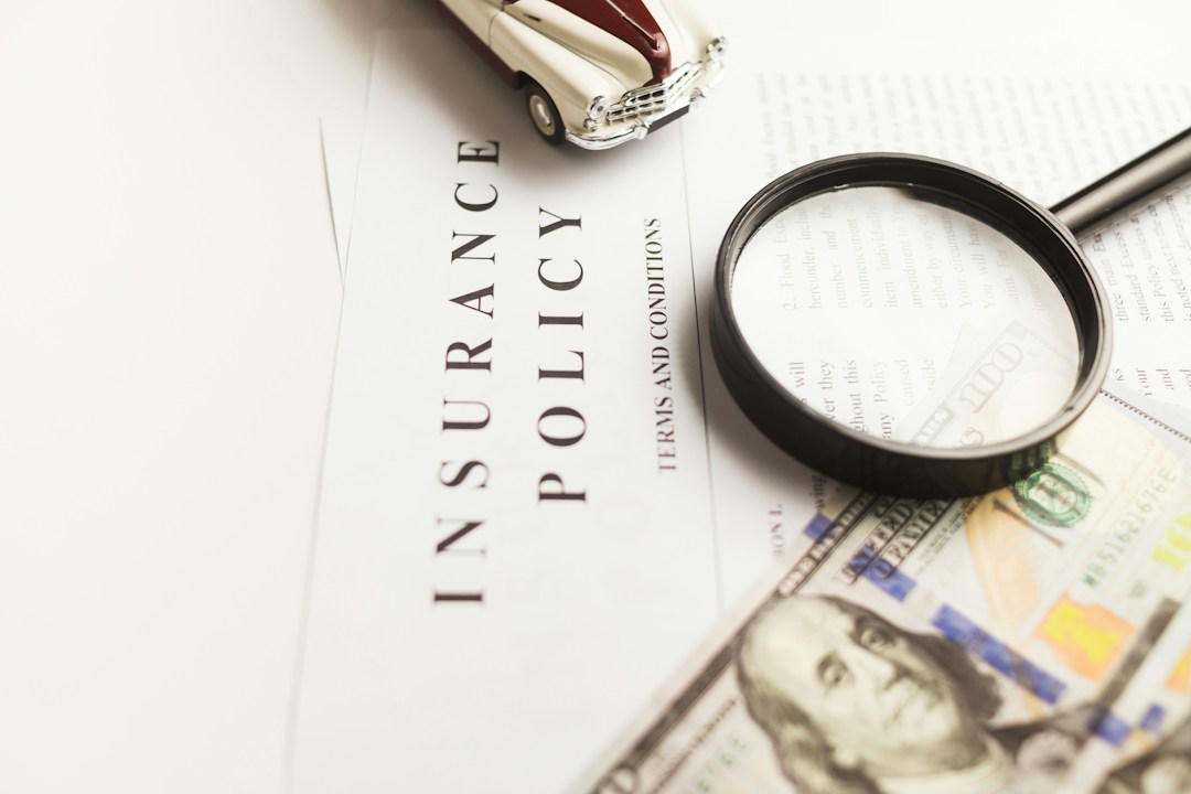 Insurance policy and legal documents with magnifying glass and money, rideshare accident compensation.
