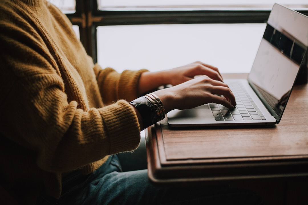 Person typing on laptop illustrating remote work and digital marketing skills.