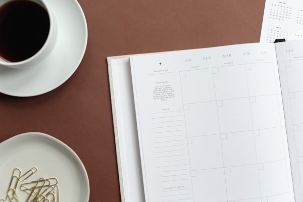 Open planner and calendar illustrating daily routine and organization for school.