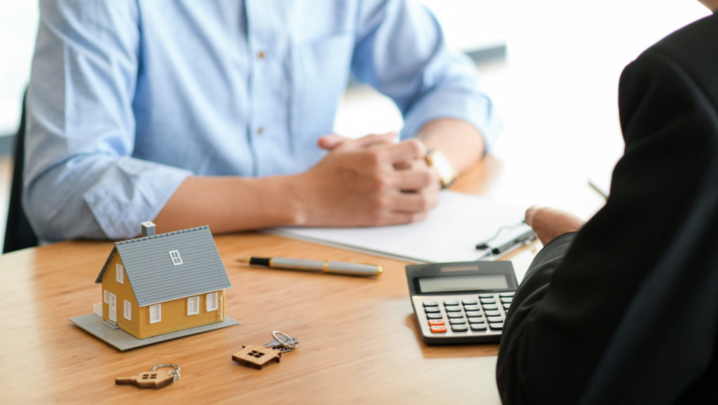 Cropped shot of A bank representative is giving advice on loan to buy a home for customer.